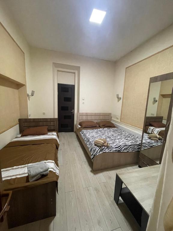 Postel nebo postele na pokoji v ubytování Fazis Hotel