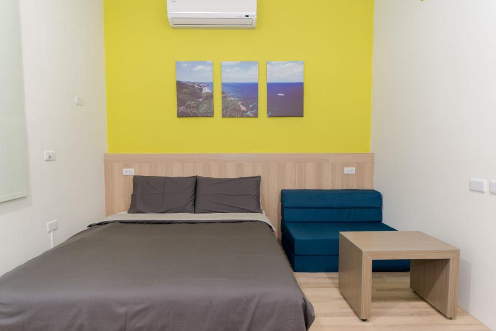 Postel nebo postele na pokoji v ubytování Colorful B&B