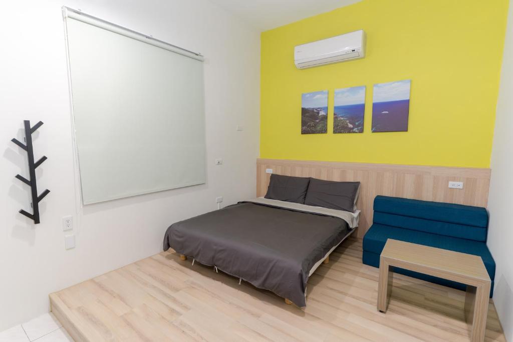 Postel nebo postele na pokoji v ubytování Colorful B&B