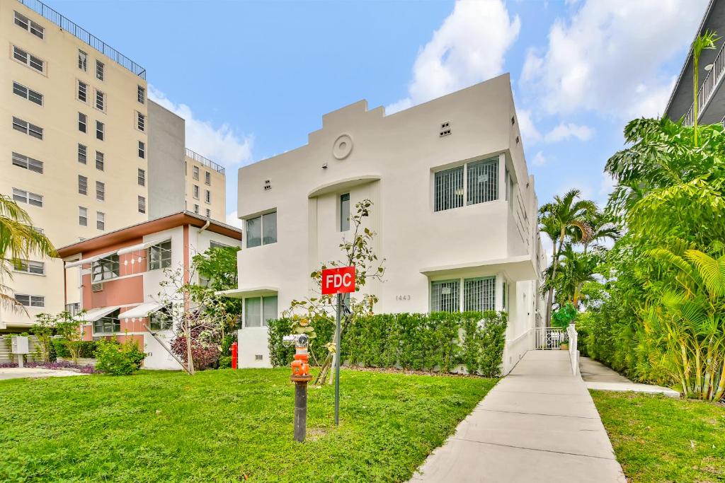 a red stop sign in front of a building at West Deco in Miami Beach