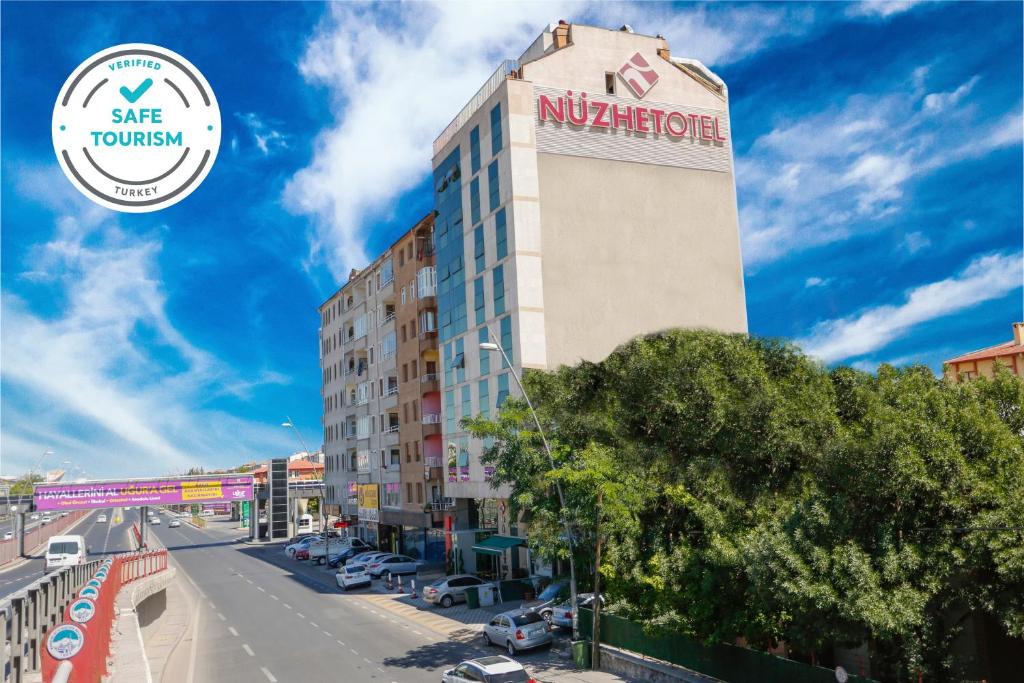 a building with a nykrite sign on top of it at Nüzhet Hotel in Kayseri