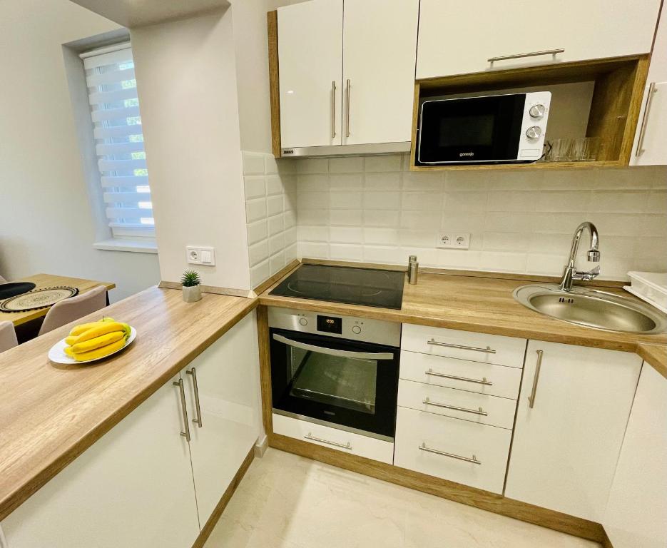 Kuchnia lub aneks kuchenny w obiekcie Vörösmarty apartmanház