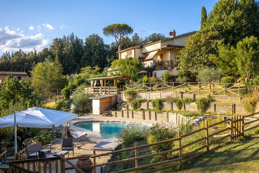 a villa with a swimming pool and a house at Toscana da Sogno a Villa Allegria in Siena