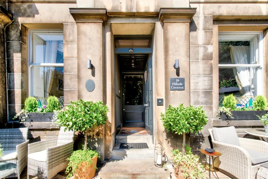 a front door of a building with plants at The Hedges in Edinburgh