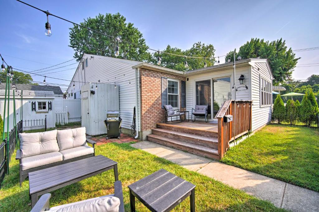 a backyard with a bench and a house at Cape May Quad with Grill - 7 Blocks to Beach! in Cape May