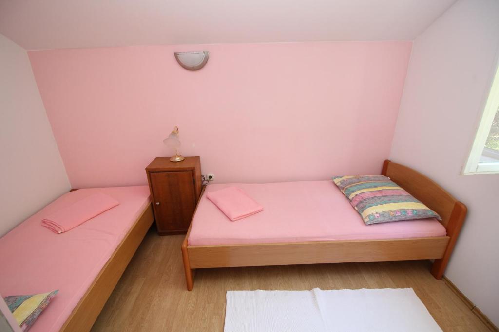 Postel nebo postele na pokoji v ubytování Holiday Home Gea
