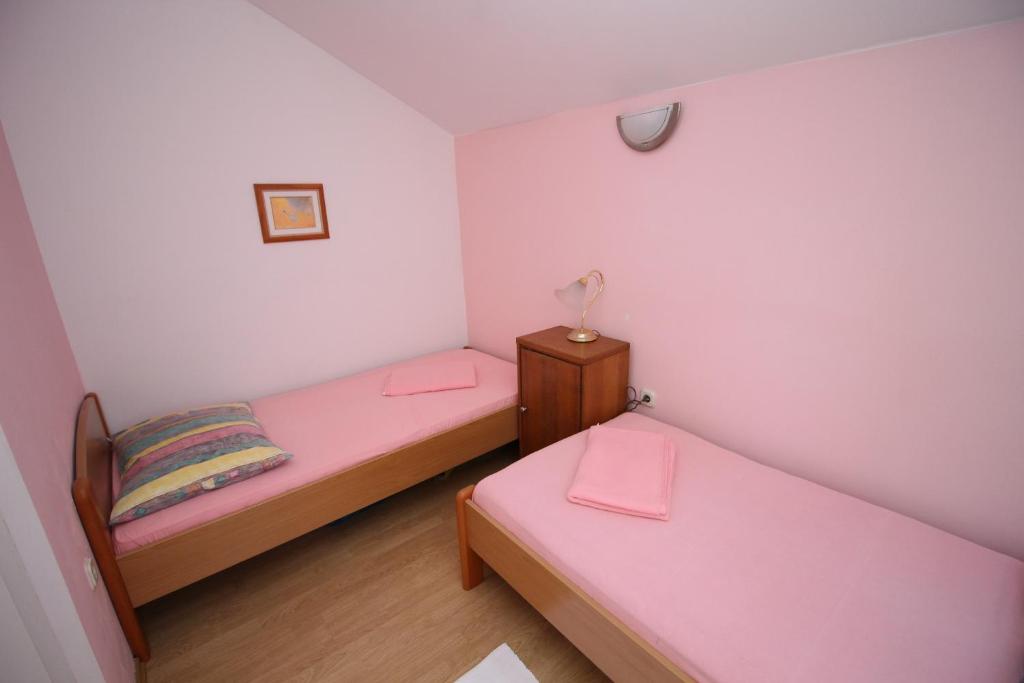 Postel nebo postele na pokoji v ubytování Holiday Home Gea