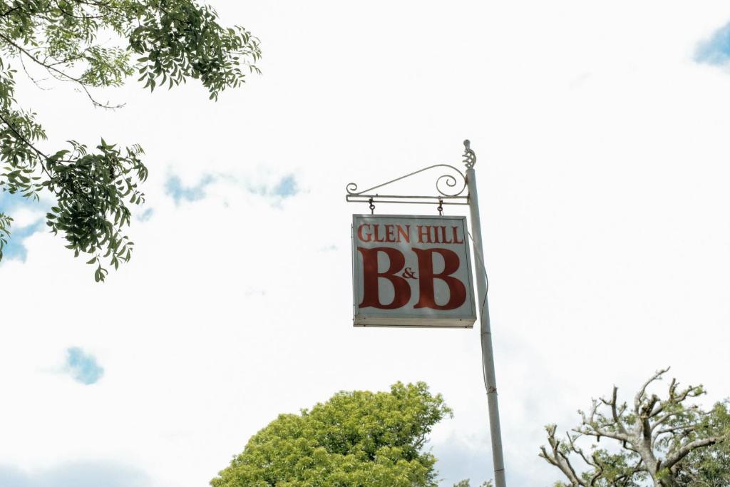 a sign for a bbb sign on a street at Glenhill B&B in Wexford