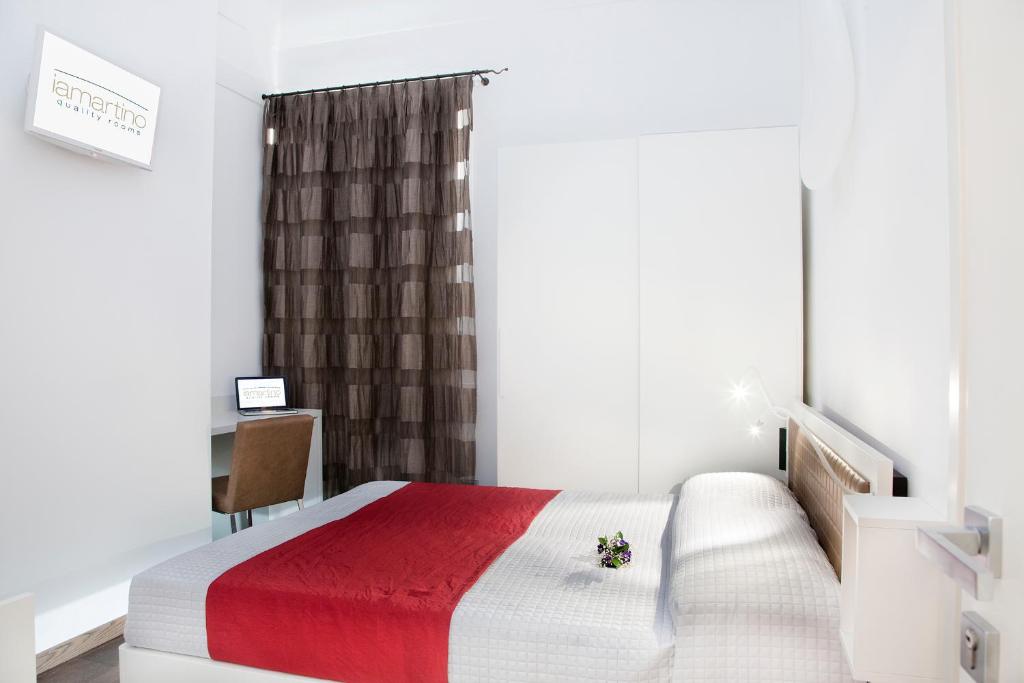 Łóżko lub łóżka w pokoju w obiekcie Iamartino Quality Rooms