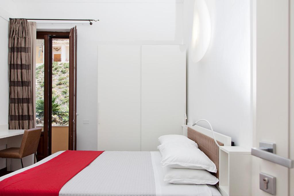 Łóżko lub łóżka w pokoju w obiekcie Iamartino Quality Rooms