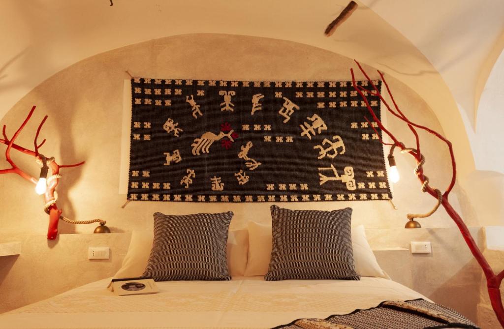 Postel nebo postele na pokoji v ubytování Hotel Anticos Palathos