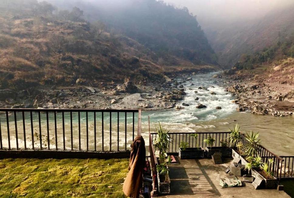 a view of a river from a balcony at Hotel La Orilla Muzaffarabad in Muzaffarabad