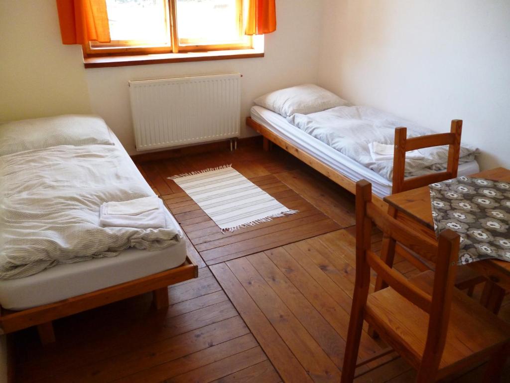 Postel nebo postele na pokoji v ubytování Švehlíkova Chata