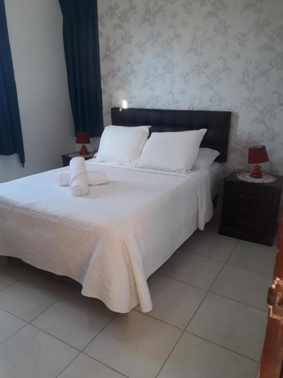 Postel nebo postele na pokoji v ubytování Hotel Valeritos