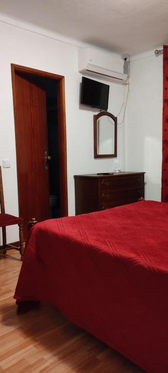 Postel nebo postele na pokoji v ubytování Residencial Do Rita em Rio Caldo