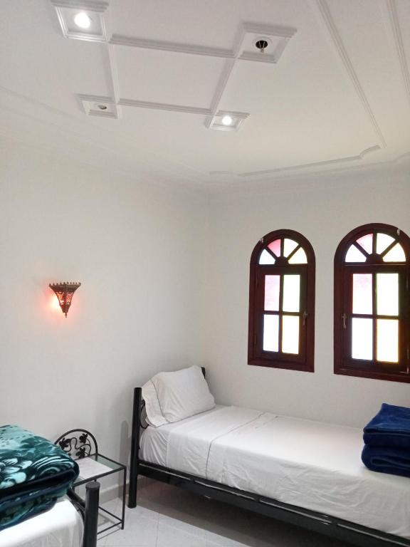Postel nebo postele na pokoji v ubytování Hôtel Sid El Aidi Médina