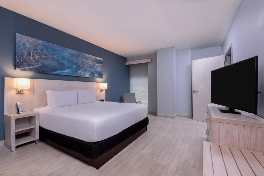 TV a/nebo společenská místnost v ubytování Hyatt Place San Pedro