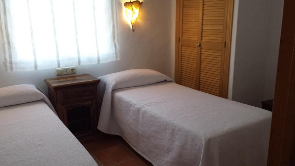 A bed or beds in a room at Casas Isabel