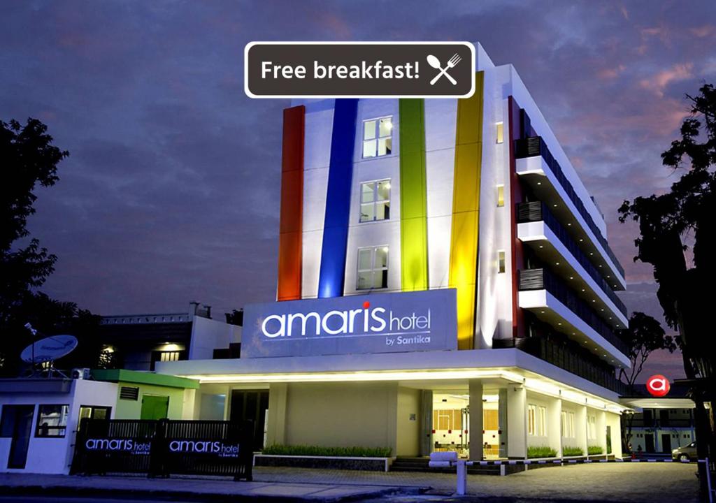 a building with a sign on top of it at Amaris Hotel Cirebon in Cirebon