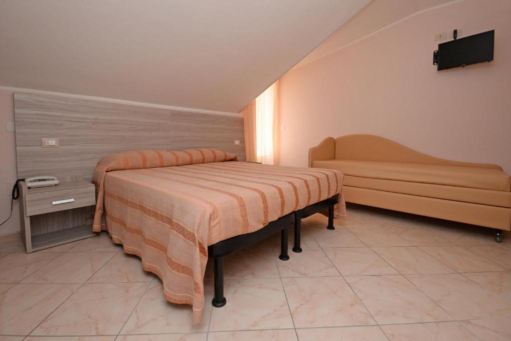 Postel nebo postele na pokoji v ubytování Hotel Concorde