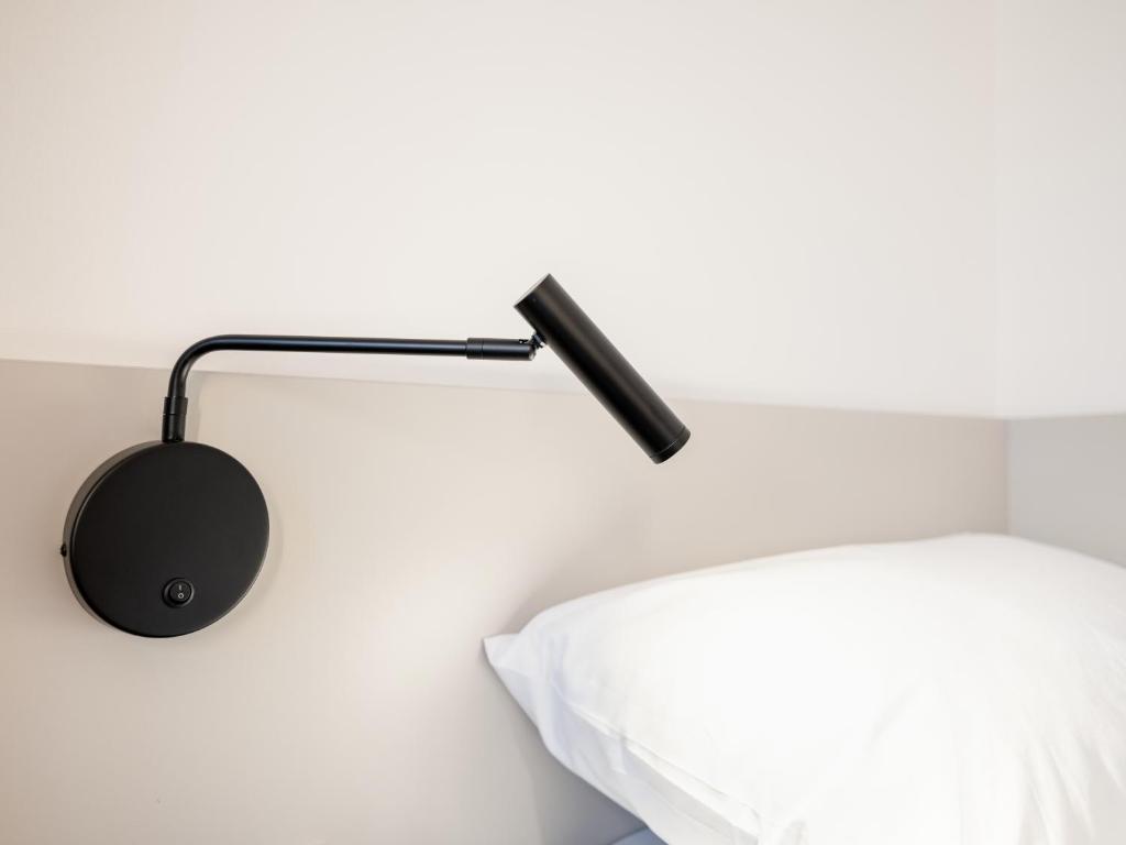 Letto o letti in una camera di Hotel AT HOME - late arrival self check in
