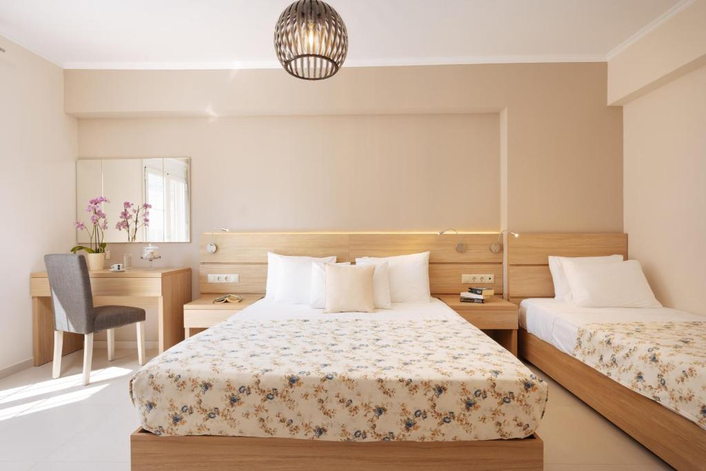 Postel nebo postele na pokoji v ubytování Lamon Hotel
