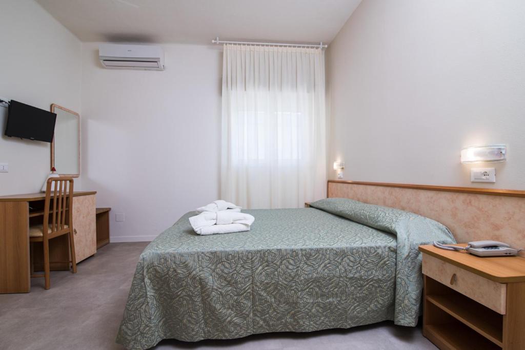 Postel nebo postele na pokoji v ubytování Hotel Ondina e Milazzo