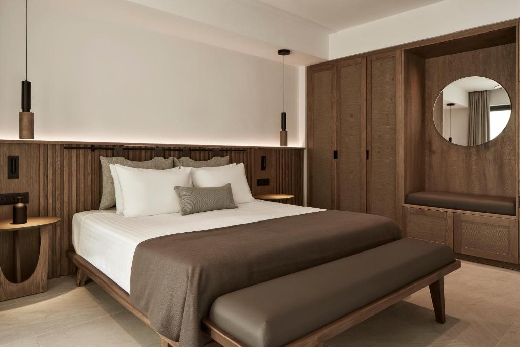 Postel nebo postele na pokoji v ubytování The Olivar Suites