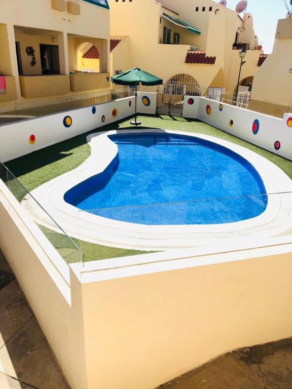 Bazén v ubytování Amazing holidays in Tenerife with wifi nebo v jeho okolí