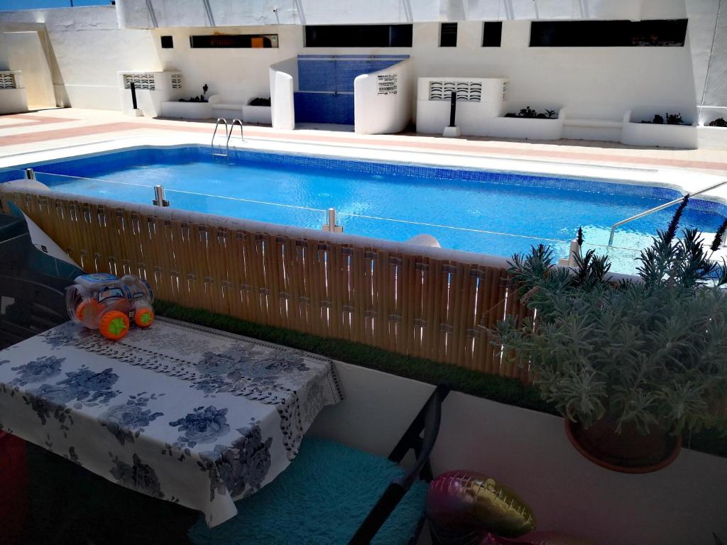 A piscina em ou perto de BEN'SHOLIDAYFLAT Ideal for families groups and couples Terrace Solarium Wi-Fi Netflix Smart TV