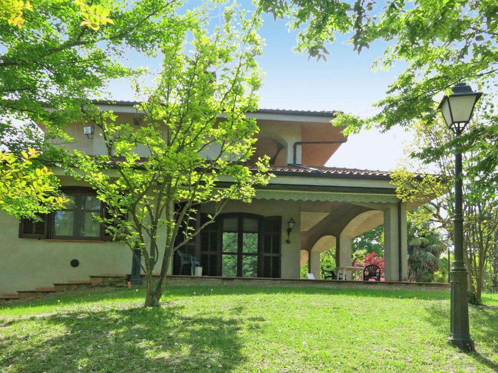 a house with a tree in front of it at Holiday Home Culla di Stelle by Interhome in Calosso