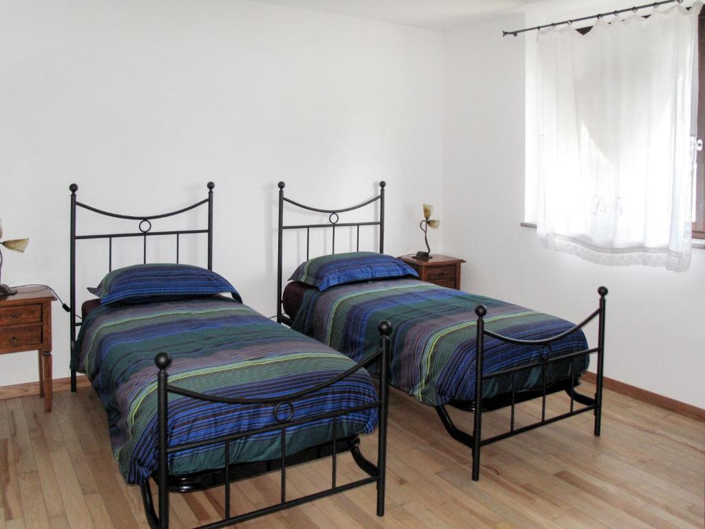 Posteľ alebo postele v izbe v ubytovaní Holiday Home Domus Magna-4 by Interhome