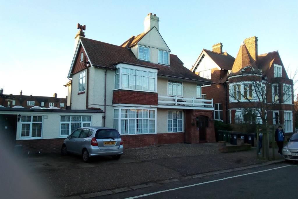 a house with a car parked in front of it at Leylands - Perfect location near town and beach in Cromer