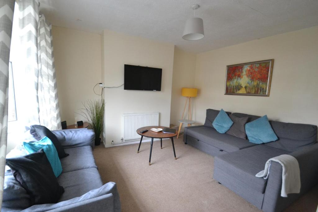 a living room with a couch and a table at 14 Castle View Red Lake in Telford