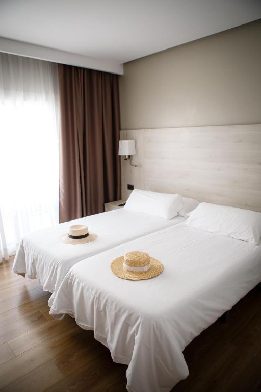 Postel nebo postele na pokoji v ubytování Hotel Helios Lloret