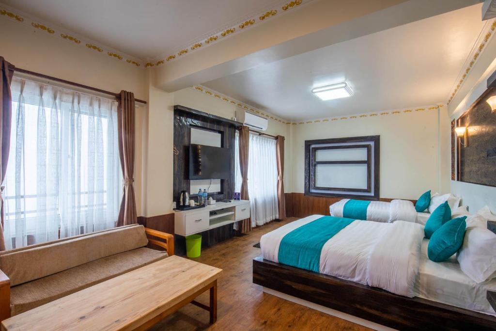 Postel nebo postele na pokoji v ubytování Hotel Himalayan Glacier