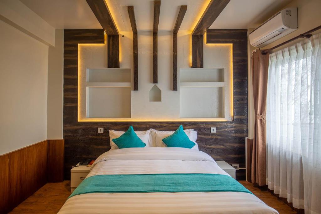 Postel nebo postele na pokoji v ubytování Hotel Himalayan Glacier