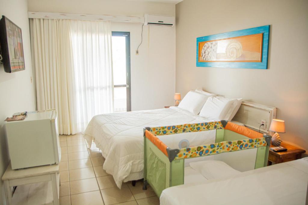Postel nebo postele na pokoji v ubytování Cahy Praia Hotel