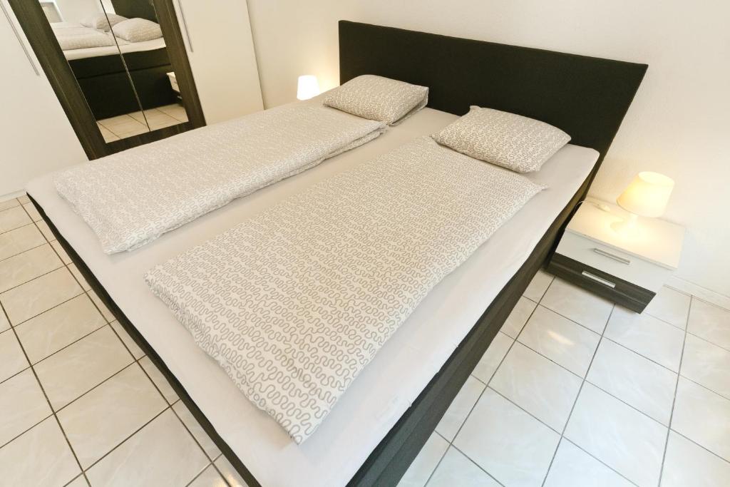 Posteľ alebo postele v izbe v ubytovaní Apartments in Vienna near Schönbrunn & Westbahnhof - Keyless Check-In