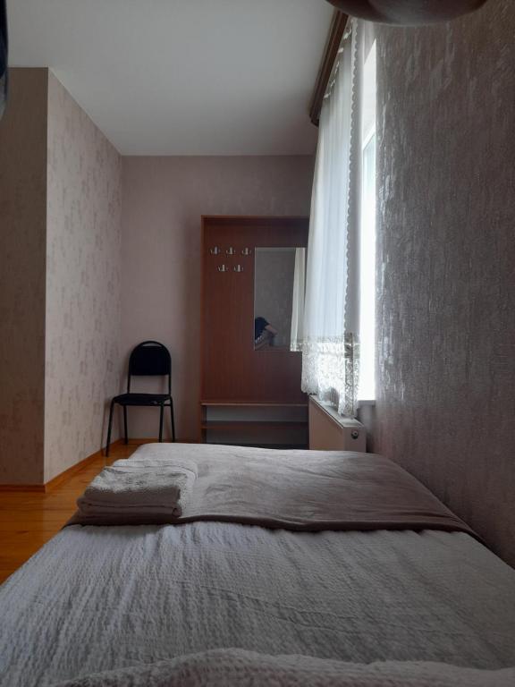 Postel nebo postele na pokoji v ubytování Kera Guest House