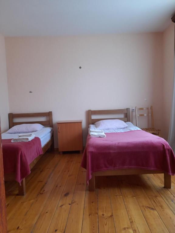 Postel nebo postele na pokoji v ubytování Kera Guest House