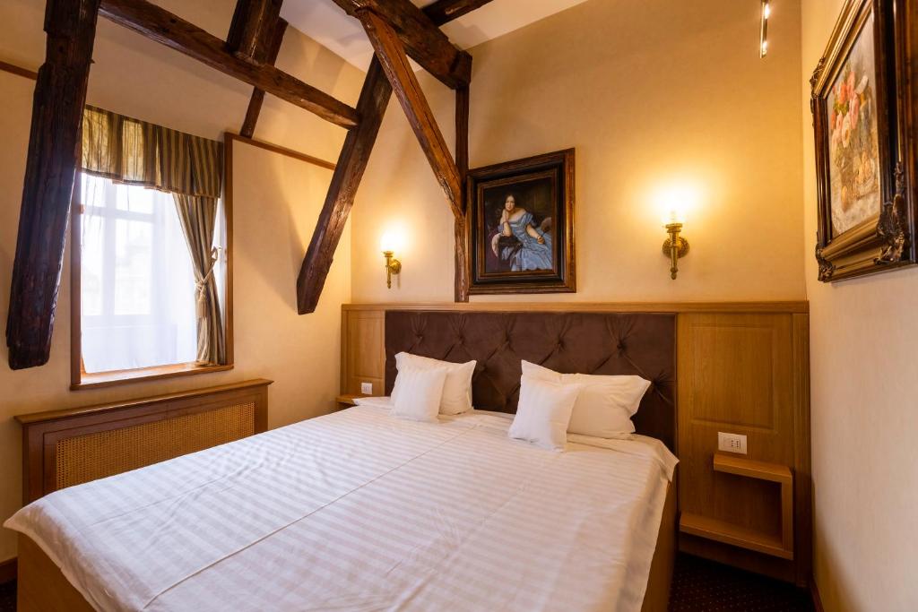 Postel nebo postele na pokoji v ubytování Hotel Am Ring