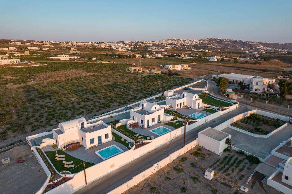 an aerial view of a villa in a city at Kyklos Villas - luxury villas with private pool in Karterados