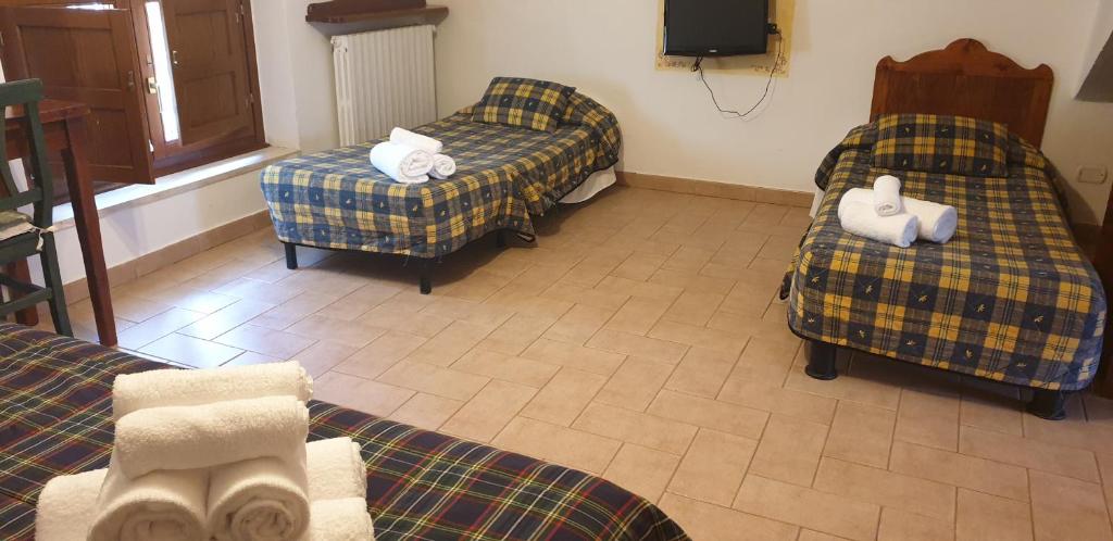 Postel nebo postele na pokoji v ubytování LH Albergo il Paradiso