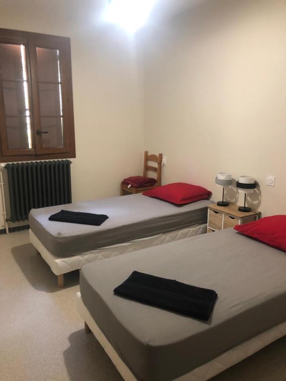 Postel nebo postele na pokoji v ubytování Gîte d'étape Chez François