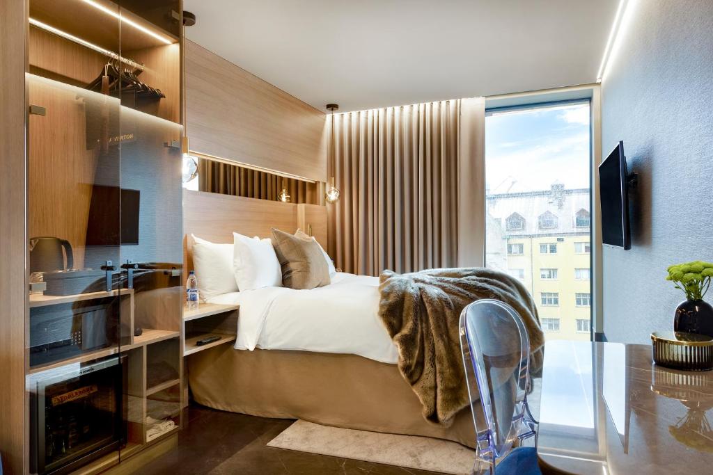 Postel nebo postele na pokoji v ubytování Hotel Riverton