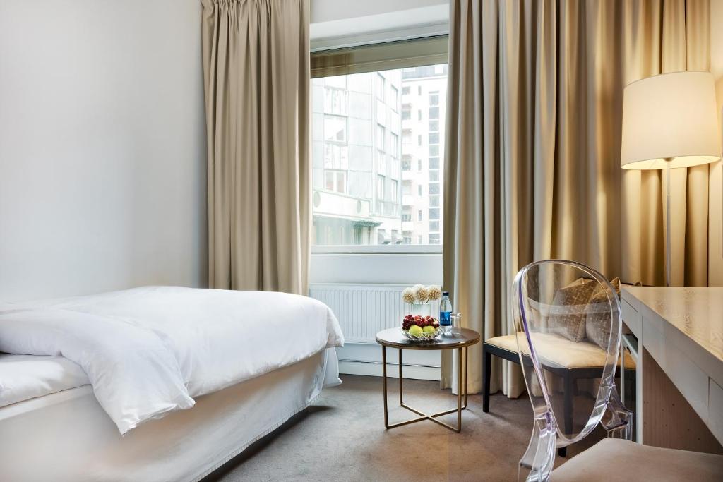 Postel nebo postele na pokoji v ubytování Hotel Riverton