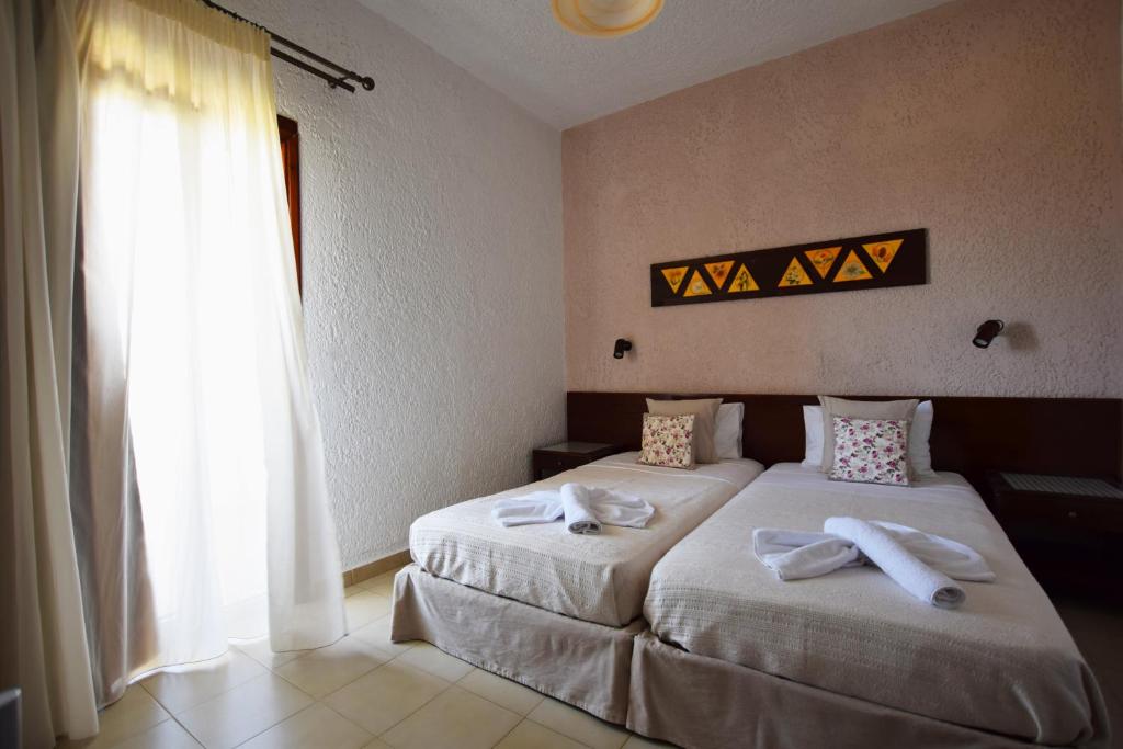 Postel nebo postele na pokoji v ubytování Altis Hotel