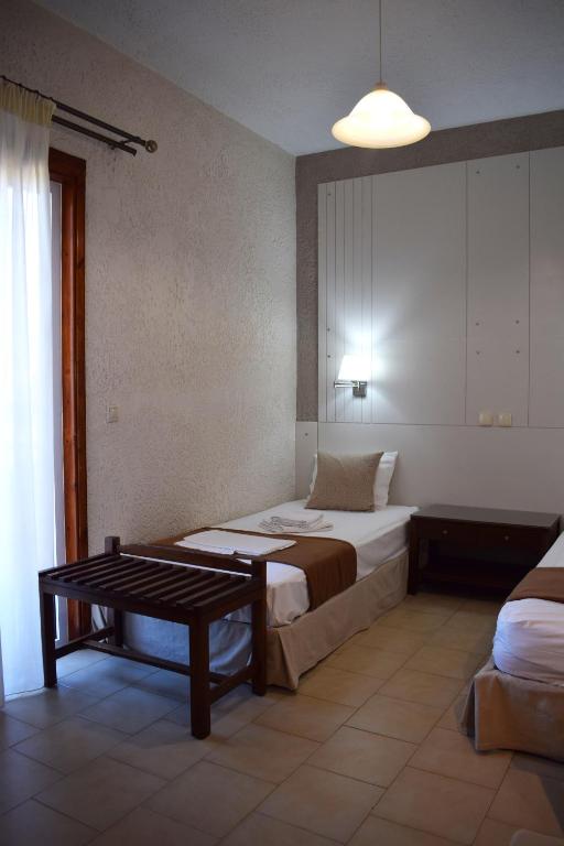 Postel nebo postele na pokoji v ubytování Altis Hotel