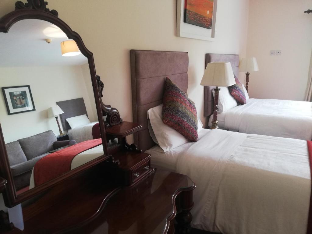 Postel nebo postele na pokoji v ubytování O'Sheas Ceol Na Habhann B&B